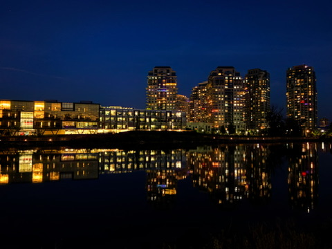 Waterloo’s skyline reflected in the water at night